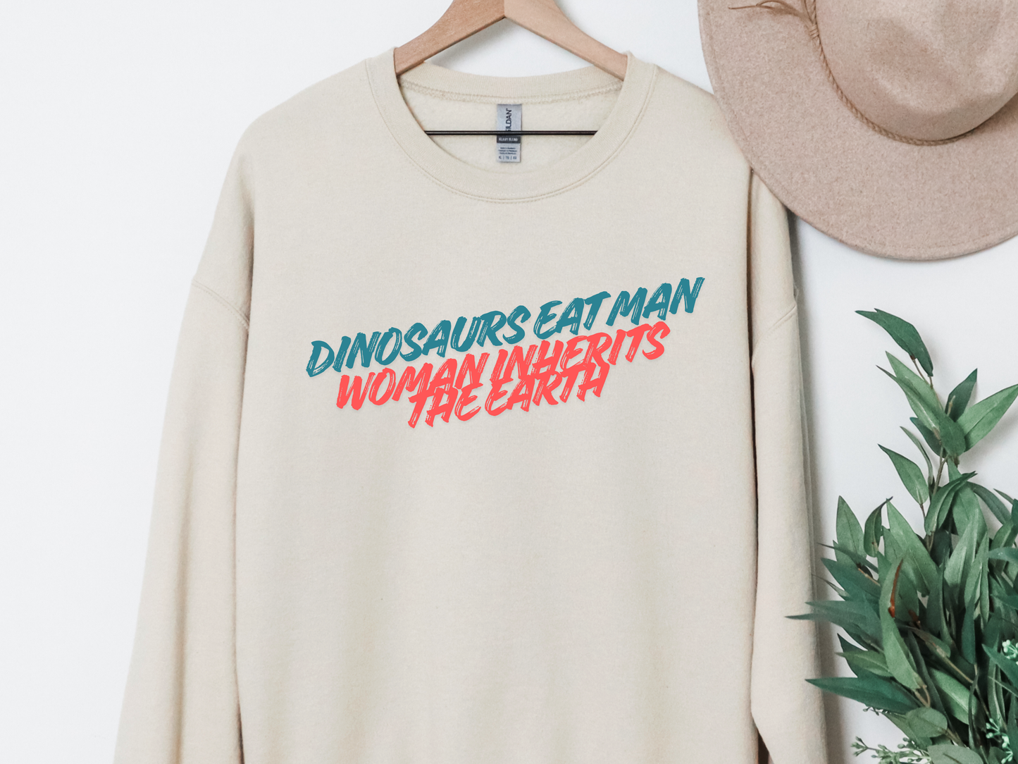 "Dinosaurs Eat Man Woman Inherits The Earth" Crewneck