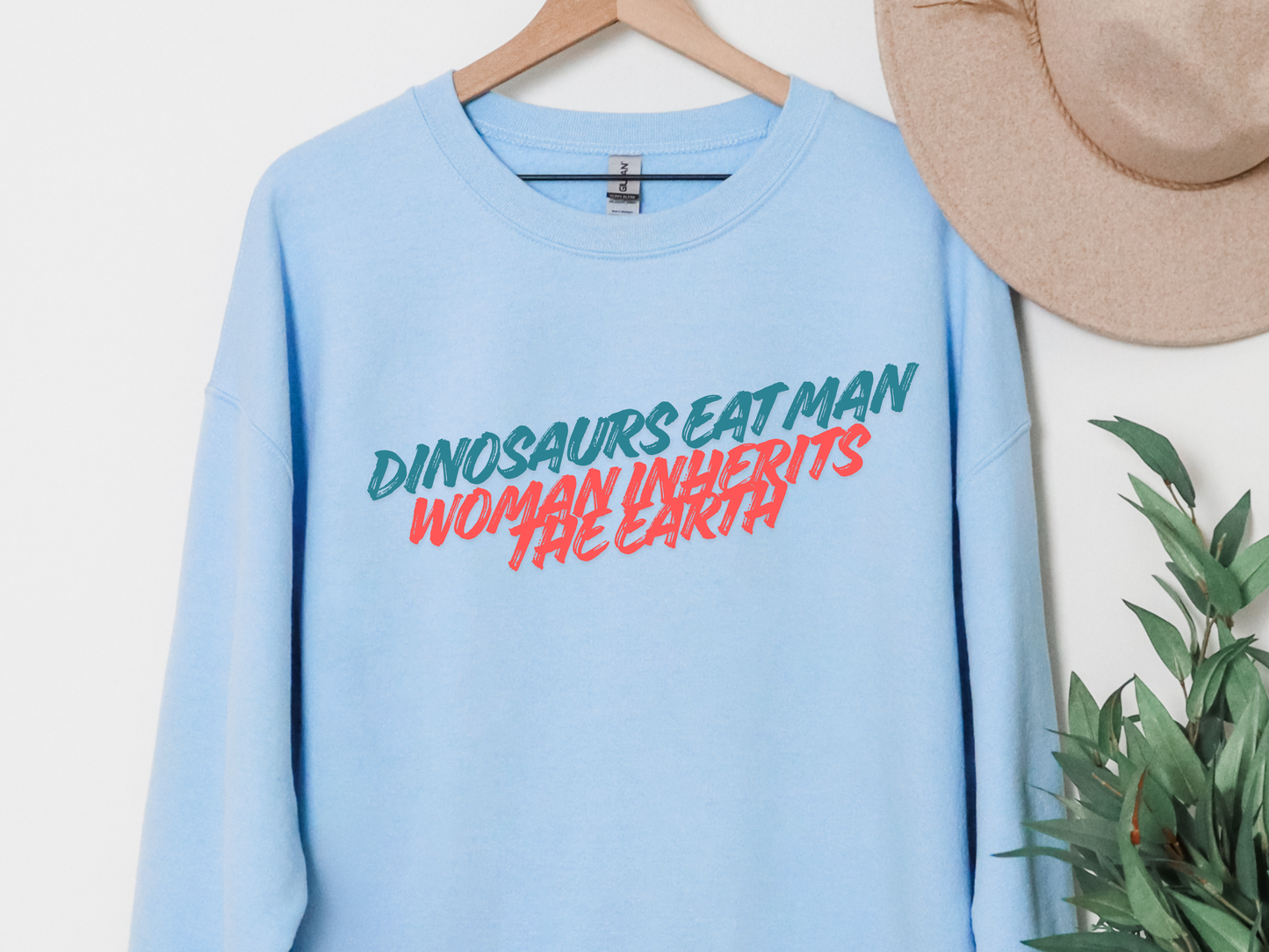 "Dinosaurs Eat Man Woman Inherits The Earth" Crewneck